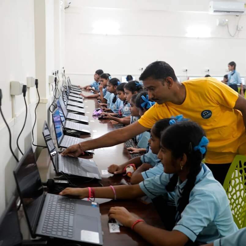 Students in computer labs installed by Child Help Foundation