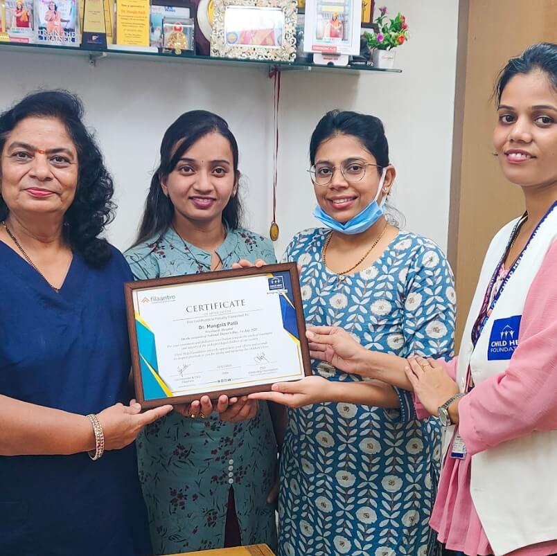 Child Help Foundation team presents a certificate of appreciation to a doctor on National Doctors' Day 2026